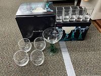 Photo showing 4 stemless wine glasses, 5 square shot glasses, 1 margarita glass and original boxes.