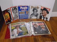 Photo showing a row of vintage magazines featuring Princess Diana and Frank Sinatra on the covers, including People, Newsweek, and EW Weekly editions.