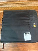 Closed black fabric Case Logic CD holder with label showing capacity for 169 CDs.