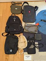 Top view photo showing all 8 bags arranged on floor, various styles and colors visible