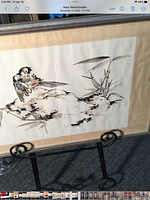 Full view of the framed Chinese ink and watercolor painting depicting a bird on rocks with bamboo, showing the linen mat and part of the stand.