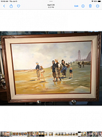 Full framed oil painting showing several figures on beach by water, vintage wood frame noticeable.