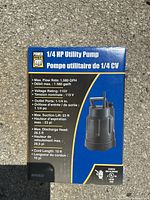 Front of the box showing the product image and specs including max flow rate 1,580 GPH, voltage 115V, outlet port size 1-1/4 inch, cord length 10 ft.