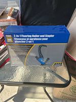 Box front showing the Power Fist 2-in-1 Flooring Nailer and Stapler text with image of the tool.