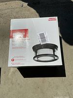 Box of Project Source flushmount ceiling light fixture with black finish and frosted glass shade
