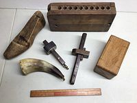 Full lot showing wooden cigar mould, shoe form, powder horn, two scribes, wooden box and ruler.