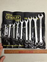 Photo showing 10 Stanley SAE combination wrenches in black vinyl Stanley pouch, sizes range 1/4 inch to 3/4 inch.