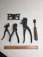 Five assorted hand tools for saw setting plus wooden ruler