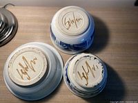 Bottom view of all three bowls showing John Schulps signature on each.