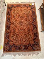 Top-down photo of the rectangular accent rug showing full design and colors.