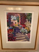 Frontal view of the framed painting "Archway" showing colorful garden scene and wooden frame