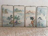 Four hand painted silk wall hanging panels displayed together showing full artwork and condition.