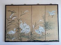 Full front view of the four-panel screen mounted on wall