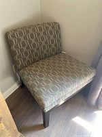 Front angled view of fabric accent chair