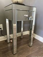 Full view of mirrored nightstand showing overall design and proportions