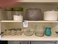 Entire lot on cupboard shelves showing all items