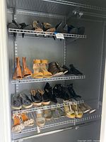 Full view of closet shelves showing all shoe pairs