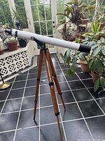 Full view of assembled telescope on wooden tripod