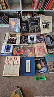 Overview of fifteen art books laid flat showing titles and covers featuring Van Gogh, Gauguin, Monet, and others.
