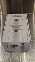 Stanley Special Edition Pour Over Set in original box, showing image of set with cone dripper and camp mug on front.