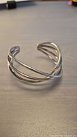 View of vintage sterling silver twisted wire cuff bracelet showing open design and twisted wire detail.