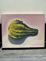 Full view of the oil painting showing a yellow and green gourd on canvas with a pink background