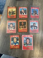 All key featured cards arranged with Joe Theismann rookie card, Tom Wilkinson, Dave Cutler, A.D. Whitfield, Tommy Joe Coffey, Bill Symons, Bob Swift, and Dick Dupuis shown clearly in vintage O-Pee-Chee style.