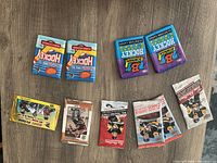 Photo showing 10 sealed hockey card packs from Upper Deck, Bowman, OPC, and Tim Hortons, spanning years 1991 through 2019 with vintage and modern designs.