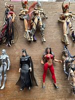 Top view of 8 female action figures including Lady Death, Purgatori, Lady Demon, and other gothic fantasy styled heroines showing detailed armor and wings