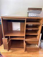 Full front view with doors and compartments open showing spacious interior shelving and storage spaces