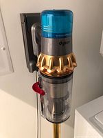 Vacuum mounted on wall dock showing full assembly