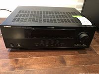 Front view of Yamaha RX-V450 receiver showing brand, model, ventilation and control buttons.