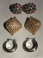 Set of 6 earrings displayed showing multicolored rhinestone cluster earrings, gold-tone basket weave earrings, and silver-tone hoops.