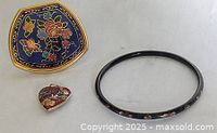 Three-piece lot showing cloisonné compact mirror, bracelet, and heart pendant with multicolor floral and butterfly designs