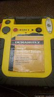 Top view of Durabuilt jumpstart system showing label and controls including a built-in light.