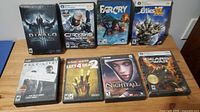 Photo of 8 boxed PC games including Diablo II, Crysis Warhead, Far Cry, Cities XL, Half-Life 2, Left 4 Dead 2, Nightfall, Gears of War.