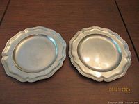 Front view of both pewter charger plates
