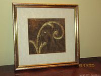 Overall view of framed silk embroidery fragment