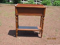 Front view of wooden flower stand showing overall design and liner