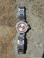 Front view of Cartier Pasha watch showing pink dial and missing bezel/crystal