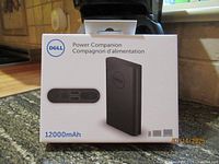 Front of Dell Power Companion retail box showing product image and 12000mAh rating