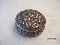 Top view showing repousse floral lid