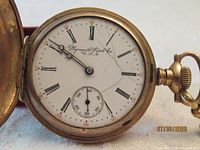 Dial view showing Plymouth Watch Co branding, Roman numerals, subsidiary seconds