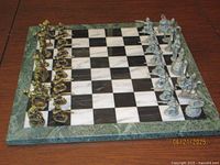 Full view of marble board with all pewter pieces set up