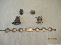 Group shot displaying all five sterling silver pieces