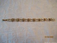 Full view of bracelet laid flat showing overall design and clasp