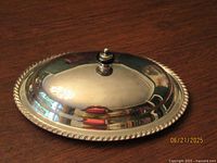 domed lid top view showing knob finial and rope edge