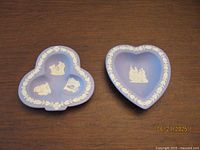 Both trinket dishes top view showing shapes and relief designs