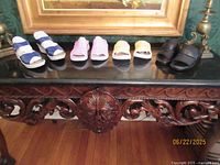 All four shoe pairs arranged on table