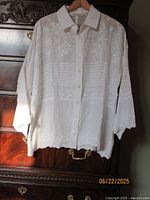Front view Soft Surroundings white embroidered blouse on hanger
